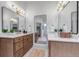 Bathroom with double sinks and large mirrors at 6379 Spotted Fawn Run, Littleton, CO 80125
