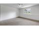 Minimalist bedroom with carpet, a ceiling fan, a window, and natural light at 6379 Spotted Fawn Run, Littleton, CO 80125