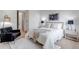 Cozy bedroom with a comfortable queen-sized bed, modern furnishings, and plenty of natural light at 6379 Spotted Fawn Run, Littleton, CO 80125