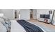 Bedroom showing ensuite bath access, and neutral walls and floors at 6379 Spotted Fawn Run, Littleton, CO 80125