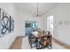 Elegant dining room boasting natural light, patio access, and modern decor at 6379 Spotted Fawn Run, Littleton, CO 80125