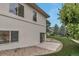 Exterior view of a house, with a lush yard and trees and a concrete patio at 6379 Spotted Fawn Run, Littleton, CO 80125