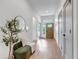 Bright hallway with hardwood floors, stylish decor, and a welcoming atmosphere at 6379 Spotted Fawn Run, Littleton, CO 80125