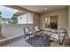 Inviting outdoor patio with ample seating and a serene atmosphere for relaxation at 6379 Spotted Fawn Run, Littleton, CO 80125