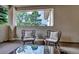 Cozy outdoor patio with comfortable seating perfect for relaxing and enjoying the view at 6379 Spotted Fawn Run, Littleton, CO 80125