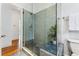 Bathroom featuring a glass door shower with tiled walls and bench at 721 Monroe St, Denver, CO 80206