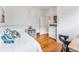 Cozy bedroom with hardwood floors, white walls, and decorative accents at 721 Monroe St, Denver, CO 80206