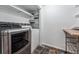 Convenient laundry area with modern washer and dryer units and shelving at 721 Monroe St, Denver, CO 80206