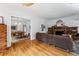 Open concept living room featuring fireplace, hardwood floors, and view to dining room at 721 Monroe St, Denver, CO 80206