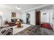 Cozy living room featuring a couch, coffee table, and tiled floors at 721 Monroe St, Denver, CO 80206