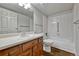 Bathroom featuring a white vanity, matching toilet and bathtub, and coordinated fixtures at 13991 E Marina Dr # 505, Aurora, CO 80014
