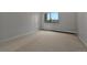 Well-lit bedroom with wall to wall carpet and a large window for ample natural light at 13991 E Marina Dr # 505, Aurora, CO 80014