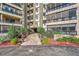 Well-maintained building entrance with landscaped walkway and clear signage displaying the address at 13991 E Marina Dr # 505, Aurora, CO 80014