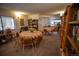 Cozy library space with reading tables, chairs, bookshelves, and natural light at 13991 E Marina Dr # 505, Aurora, CO 80014