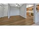 Spacious living room area with wood floors leads into a kitchen with wood cabinets at 13991 E Marina Dr # 505, Aurora, CO 80014