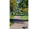 Scenic walking path through the park featuring mature trees and lush greenery at 13991 E Marina Dr # 505, Aurora, CO 80014
