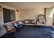 A shaded patio with comfortable seating, including benches, chairs, and an egg chair at 13991 E Marina Dr # 505, Aurora, CO 80014