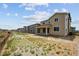 Exterior view of backyard with patio of houses, landscaping and fencing at 24707 E 40Th Ave, Aurora, CO 80019