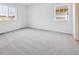 Bright bedroom with two windows, neutral carpet and light walls at 24707 E 40Th Ave, Aurora, CO 80019