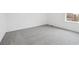 Bright bedroom features neutral carpet, white walls, baseboards, and a window at 24707 E 40Th Ave, Aurora, CO 80019
