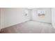 Spacious bedroom with two windows, neutral carpet and light walls at 24707 E 40Th Ave, Aurora, CO 80019