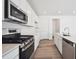 Beautiful kitchen featuring stainless steel appliances, ample counter space and eat-in island at 24707 E 40Th Ave, Aurora, CO 80019
