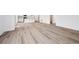 Spacious living room featuring wood floors, white walls and seamless open-concept design at 24707 E 40Th Ave, Aurora, CO 80019