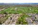 Scenic aerial view overlooking a neighborhood, golf course, and the distant mountain range at 6305 W 6Th Ave # C17, Lakewood, CO 80214