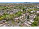 Wide aerial view of a neighborhood with green trees and houses stretching to the horizon at 6305 W 6Th Ave # C17, Lakewood, CO 80214