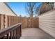 Back deck featuring wood-style floor boards and a wood railing and fence to create a private space at 6305 W 6Th Ave # C17, Lakewood, CO 80214