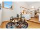 Charming dining area featuring a modern table set, area rug, and abundant natural light at 6305 W 6Th Ave # C17, Lakewood, CO 80214
