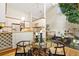 Contemporary kitchen with modern appliances that connects to the bright dining area and water feature at 6305 W 6Th Ave # C17, Lakewood, CO 80214