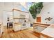 Well-lit kitchen featuring bright countertops, modern appliances, and a charming indoor tree feature at 6305 W 6Th Ave # C17, Lakewood, CO 80214