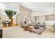 Bright, open-concept living room with high ceilings, skylights, and a cozy seating area at 6305 W 6Th Ave # C17, Lakewood, CO 80214