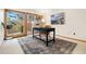 Bright office space with neutral carpet, desk and an outdoor view through a large window at 6305 W 6Th Ave # C17, Lakewood, CO 80214