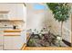 Unique kitchen with stone water feature and modern appliances and bright countertop at 6305 W 6Th Ave # C17, Lakewood, CO 80214