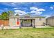Backyard featuring a covered patio with seating, a well-maintained lawn, and a charming single-Gathering home at 2850 Roosevelt, Thornton, CO 80229
