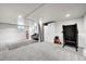 Finished basement with treadmill, storage cabinet and cozy seating area at 2850 Roosevelt, Thornton, CO 80229