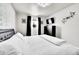 A modern bedroom with neutral walls, soft carpet and decorative wall art at 2850 Roosevelt, Thornton, CO 80229