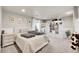 Finished basement bedroom with white shelves, bed, and a window at 2850 Roosevelt, Thornton, CO 80229