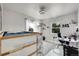 A bedroom featuring a loft bed, desk, carpeted floor, and plenty of natural light at 2850 Roosevelt, Thornton, CO 80229