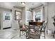 Dining area featuring a round table with ornate chairs and light-filled window at 2850 Roosevelt, Thornton, CO 80229