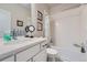 Clean bathroom with a vanity, large mirror, and a shower-tub combination at 11905 Sea Oats St, Parker, CO 80138