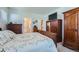 Bright bedroom with doors to ensuite bathroom and closet, a TV and storage at 11905 Sea Oats St, Parker, CO 80138