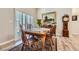 Cozy dining room with natural light, a classic wooden table, and a charming rug at 11905 Sea Oats St, Parker, CO 80138
