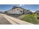 Exterior side view of the house features a lawn and stone landscaping at 11905 Sea Oats St, Parker, CO 80138