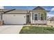 Charming single-Gathering home featuring a two-car garage, landscaped front yard, and inviting front entrance at 11905 Sea Oats St, Parker, CO 80138