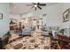Open-concept living area with living room, dining area, and kitchen, creating a seamless flow at 11905 Sea Oats St, Parker, CO 80138
