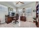 Bright office space with a computer setup, a ceiling fan and natural light at 11905 Sea Oats St, Parker, CO 80138
