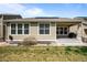 The back of a home with solar panels is visible in the yard at 827 Sundance Ln, Erie, CO 80516